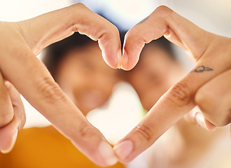 Image showing Hands, heart sign and closeup in home with couple, love or icon for romance, care or bonding. People, fingers and partnership for support, emoji or together for pride in house with blurred background