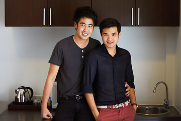 Image showing Happy, Asian and portrait of a gay couple with a hug, care and bonding in a home kitchen. Smile, lgbtq love and men together in a house to relax with an embrace and affectionate in relationship