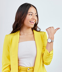 Image showing Studio pointing, business smile and happy woman with service advertising, promo news notification or brand announcement. Commercial, direction gesture or person excited for sales on white background