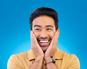 Image showing Happy, excited man and surprise face in studio with Asian model with teeth and joy. Blue background, male person and casual fashion with handsome and friendly guy with modern style and wow smile