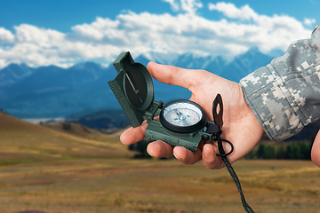 Image showing Man with compass in Altai mountains