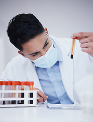 Image showing Blood test, tube and scientist man with research analysis, vaccine and healthcare face mask in laboratory. Medical, science doctor or person focus, inspection and red, dna liquid or covid 19 solution