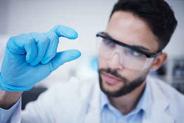 Image showing Laboratory, man or hand of scientist with small size for research, assessment or experiment innovation. Healthcare, science blur or biologist with little scale gesture for future development results