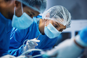 Image showing Hospital knife, surgery and doctors in theatre for medical support, teamwork and emergency healthcare with focus. Doctor, nurse and surgeon face mask, patient check and tools in operating room