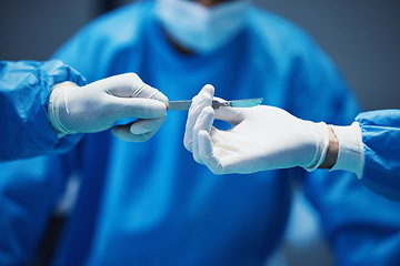 Image showing Hospital knife, surgery and doctors hands in theatre for medical support, teamwork and emergency healthcare. Doctor, nurse and surgeon team work, giving tools and helping in operating room zoom