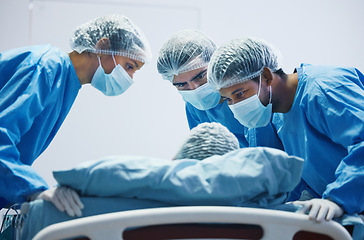 Image showing Surgery, mask and team of doctors working with patient, person in bed or operation in hospital with healthcare workers. Medicine, collaboration and trust in nurses, surgeon or people in clinic