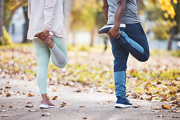 Image showing Fitness, couple and stretch with legs in outdoor for workout or sports, wellness, health. Friends, training and man with woman for warm up at park for cardio, runner or endurance with motivation.