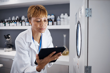 Image showing Scientist, tablet and serious woman with incubator in laboratory, research or online study. Technology, medical professional and doctor of science on internet for reading, healthcare and email app.