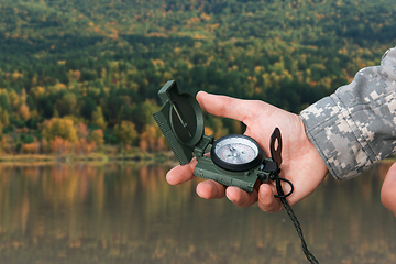 Image showing Man with compass in Altai mountains