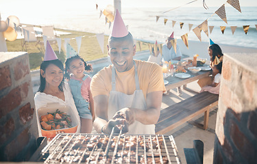 Image showing Help, birthday and family at barbecue party, lunch and summer in nature together. Camping, smile and woman helping a man with food on the grill, cooking bbq and meat on vacation by the sea for dinner