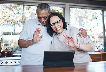 Image showing Technology, mature couple with tablet and video call in kitchen of their home for connectivity. Social networking or online communication, retirement house or happiness and senior people wave hello