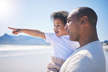 Image showing Travel, vacation and father with his baby on the beach while on a tropical family weekend trip. Happy, sightseeing and young dad standing and bonding with his infant child by the ocean on a holiday.