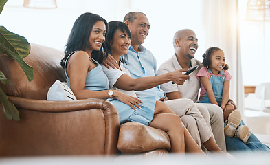 Image showing Happy, TV and family on sofa with remote for bonding, quality time and relaxing in living room. Grandparents with mother, father and child on couch streaming comedy movies, entertainment and series