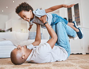 Image showing Child, dad and airplane game on floor with smile, bonding and love in living room, family home and care. Father, boy kid and together for playing, plane and excited on carpet in lounge with lifting