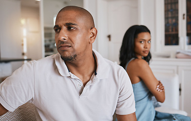 Image showing Couple, fight and frustrated on living room couch for worry, mistake or angry with anxiety in house. Man, woman or depression for conflict, drama or stress on lounge sofa for cheating, crisis or fail