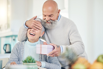 Image showing Old couple, surprise and gift with anniversary, happiness and retirement with marriage, love or relationship. Happy, senior man or elderly woman with a present, home or cheerful with romance or smile