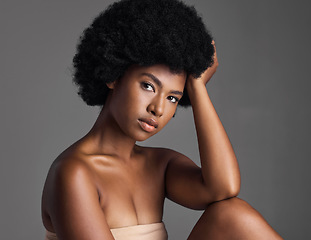 Image showing Natural beauty, serious portrait and black woman with afro, cosmetics and skincare on grey background. Skin care, studio and dermatology, face of African model with salon makeup glow and wellness.