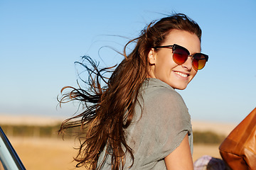 Image showing Travel, road trip and young woman with sunglasses for a summer vacation or weekend adventure. Happy, smile and female person having fun with freedom while in nature for an outdoor holiday or journey.
