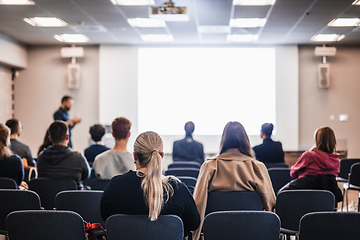 Image showing Conference and Presentation. Audience at the conference hall. Business and Entrepreneurship. Faculty lecture and workshop. Audience in the lecture hall. Academic education. Student making notes