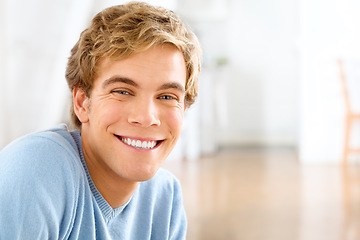 Image showing Portrait, home and man with a smile, cheerful and confident guy is his living room, casual outfit and Canadian. Face, happy male person and gentleman in his lounge, happiness and joyful with wellness