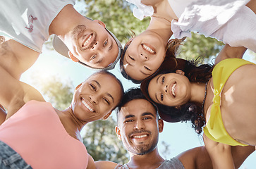 Image showing Diversity, group huddle for teamwork and happy together outside with a lens flare. Portrait or support, community or motivation and face of friends smile for summer holiday or vacation outdoors