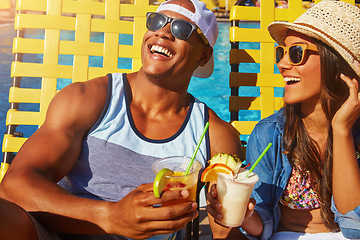 Image showing Couple, bonding and swimming pool with happiness and cocktails at resort for fun with sunshine. Drinks, summer and girl or boy at poolside for vacation to relax with smile or couple, tanning.