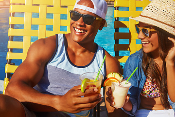 Image showing Cocktail, couple and swimming pool with sunglasses for tanning on holiday with happiness at resort. Summer, poolside with man or woman with drinks or smile to relax and enjoy at hotel with alcohol.