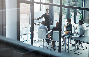 Image showing Presenter, mentorship or business people in seminar for sales report, vision or data analysis in training. Leadership, woman teaching or female manager planning strategy on screen monitor in meeting