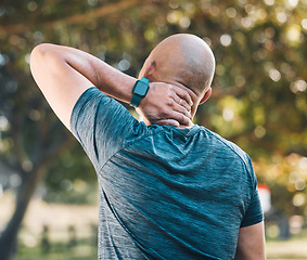 Image showing Neck pain, outdoor and man in a park with sport injury and muscle strain from fitness and workout. Exercise problem, male person and back with medical, health and problem from training accident