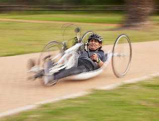 Image showing Fast, disability and fitness with man and bike with handicap for training, sports and challenge. Exercise, workout and wheelchair with disabled person cycling in park for cardio, wellness and health