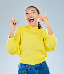 Image showing Wow, excited and woman pointing to presentation, news or announcement for creative opportunity. Show, information and happy person or model in surprise, idea or solution on a studio white background