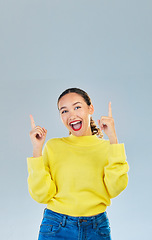 Image showing Pointing, happy and presentation with portrait of woman in studio for show, advertising and idea. Announcement, promotion and deal with person on grey background for opportunity, offer or news mockup