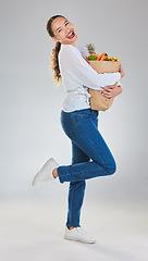 Image showing Portrait, excited and woman grocery shopping for fruits on mockup space in studio isolated on white background. Sustainable bag, food and customer with vegetables for nutrition, healthy diet or sales