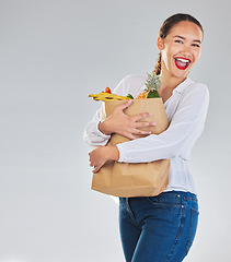 Image showing Excited, portrait and woman grocery shopping for fruits on mockup space in studio isolated on white background. Sustainable bag, food and customer with vegetables for healthy nutrition in supermarket