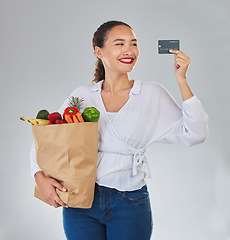 Image showing Credit card, online and woman grocery shopping for fruits, vegetables and studio isolated on a white background. Sustainable bag, food and happy customer with digital money, ecommerce and fintech.