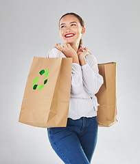 Image showing Recycling logo, environment and woman with bag, sustainability with shopping isolated on white background. Environmental, retail and eco friendly, female person and carbon footprint in studio