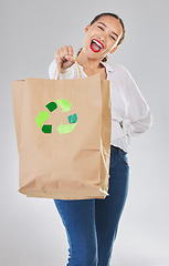 Image showing Recycling, environment and happy woman with bag, carbon footprint and sustainability with shopping on white background. Environmental, retail and eco friendly, female person excited in studio