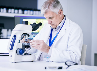 Image showing Mature scientist, man and microscope, review and analysis for science study, medical research and biotechnology in lab. Male person, doctor and pathology, check test sample with scientific experiment