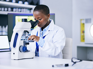 Image showing Scientist, black woman and microscope, analysis and science study with medical research and biotechnology in lab. Female person, doctor and pathology, check test sample with scientific experiment