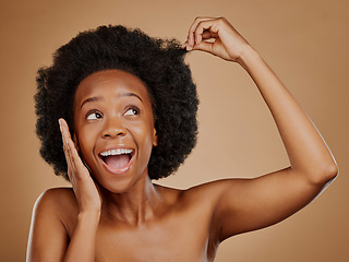 Image showing Excited black woman, hair care and afro for beauty in studio isolated on a brown background. Growth, hairstyle or happy African model with natural cosmetics after salon treatment for healthy wellness