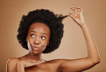 Image showing Hair care, black woman and natural afro for beauty in studio isolated on a brown background. Growth, hairstyle and African female model pose with cosmetics after salon treatment for healthy wellness