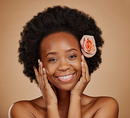 Image showing Beauty, flower and portrait of an African woman in studio with skincare, natural and face routine. Cosmetic, health and female model with floral rose in hair for facial treatment on brown background