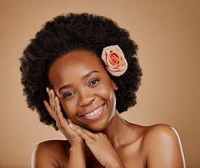 Image showing Self care, floral and portrait of woman in studio with beauty, natural and face routine. Skincare, beauty and African female model with flower rose in hair for facial treatment by a brown background.