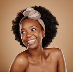 Image showing Black woman, smile and hair scarf for care in studio isolated on a brown background. Natural cosmetics, thinking and African model with head wrap after salon treatment for afro, wellness or hairstyle