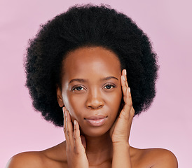 Image showing Black woman, touching face and natural beauty with afro hair, skin glow and cosmetics on pink background. African female mode, texture and portrait, facial and skincare with dermatology in studio