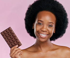 Image showing Portrait, chocolate and black woman with a smile, natural beauty and dessert on a studio background. Face, female person or Jamaican model with sweets, cocoa candy or delicious snack with sugar treat