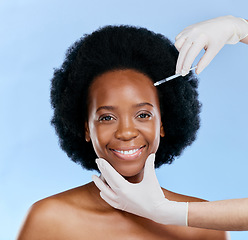 Image showing Black woman, face injection and beauty with cosmetic procedure, fillers and dermatology on blue background. Liquid collagen, facial and skincare with hands, female model and smile in portrait