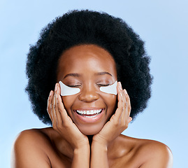 Image showing Beauty, skincare and eye mask with face of black woman in studio for facial, cosmetics and dermatology. Spa, wellness and self care with female person on blue background for salon, glow and detox