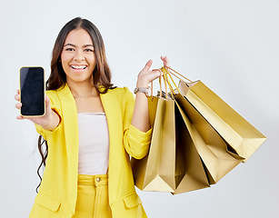 Image showing Phone, portrait or happy woman with shopping bags on mockup space for a sale, offer or discount code. Online, mobile app or excited girl customer with gift or present on promotion on white background