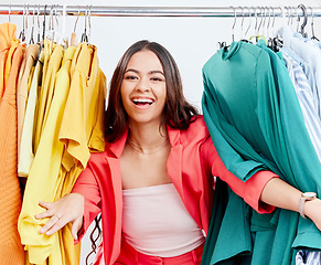 Image showing Fashion, smile and clothes with portrait of woman in studio for decision, shopping and wardrobe. Boutique, retail and store with face of customer on white background for search, creative and sale